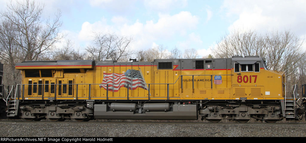 UP 8017 heads west on NS train 165